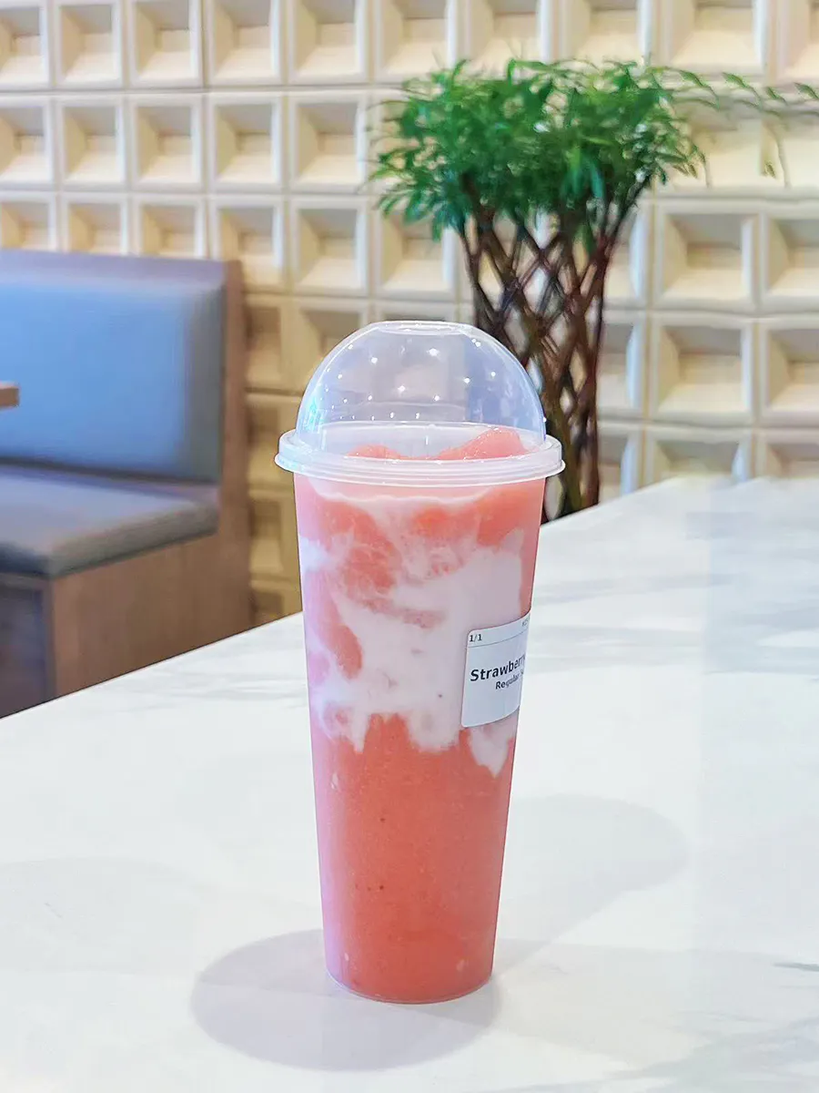 Creamy pink strawberry fruit slush drink at Mochi & Crunch Treats, a Modern Dessert Café in Tupelo