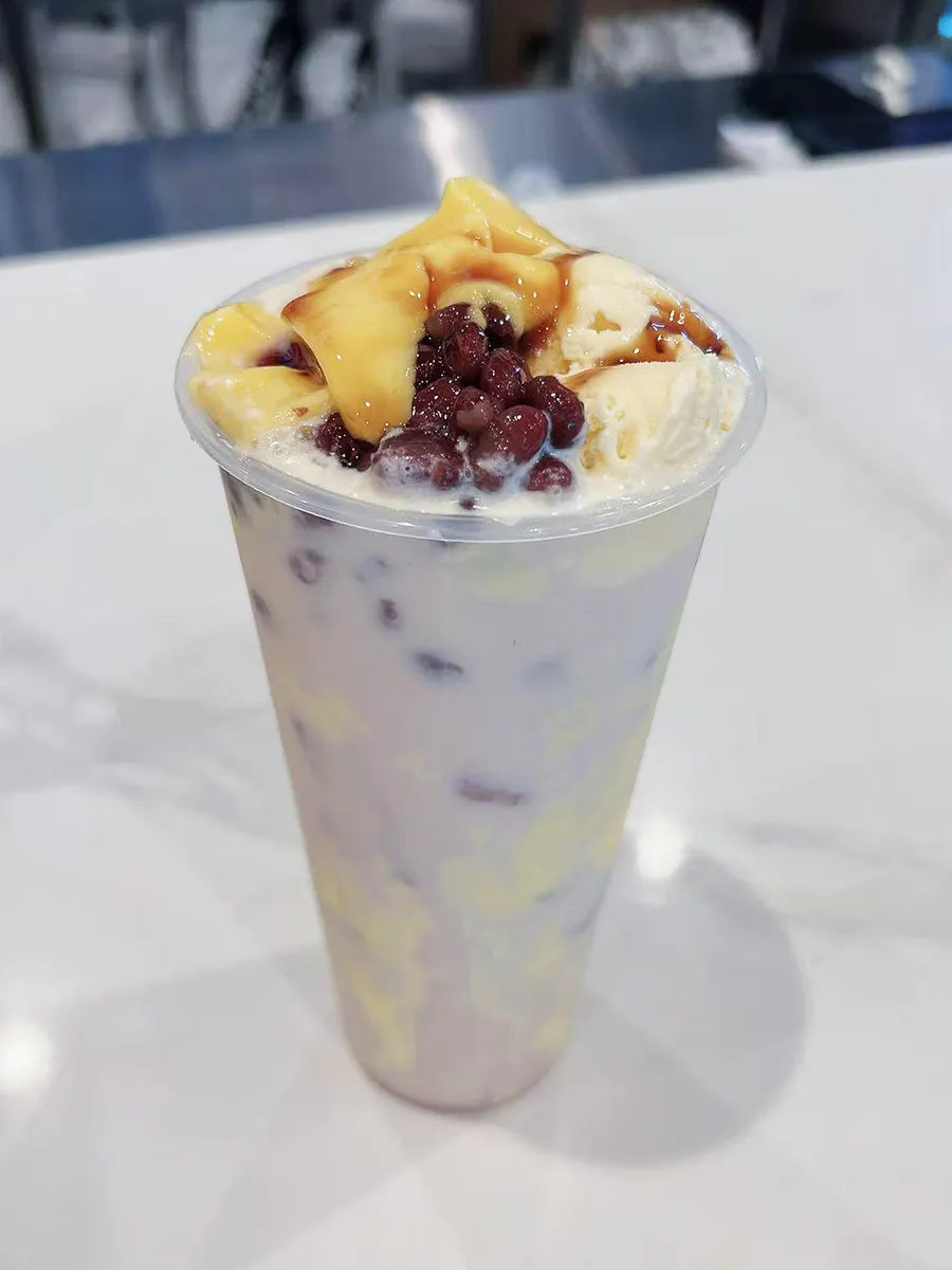 Red bean pudding taro milk tea cream ice cream topping tall plastic cup at Mochi & Crunch Treats, a Modern Dessert Café in Tupelo